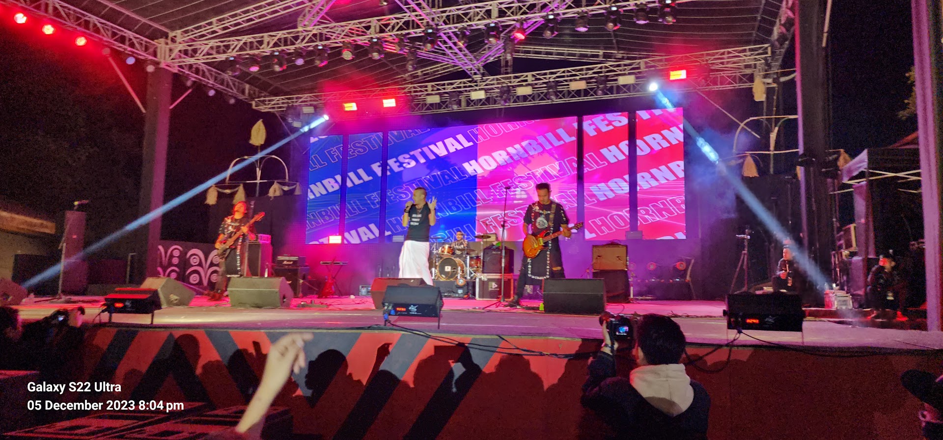 Musicians performing on the Hornbill Festival stage at night